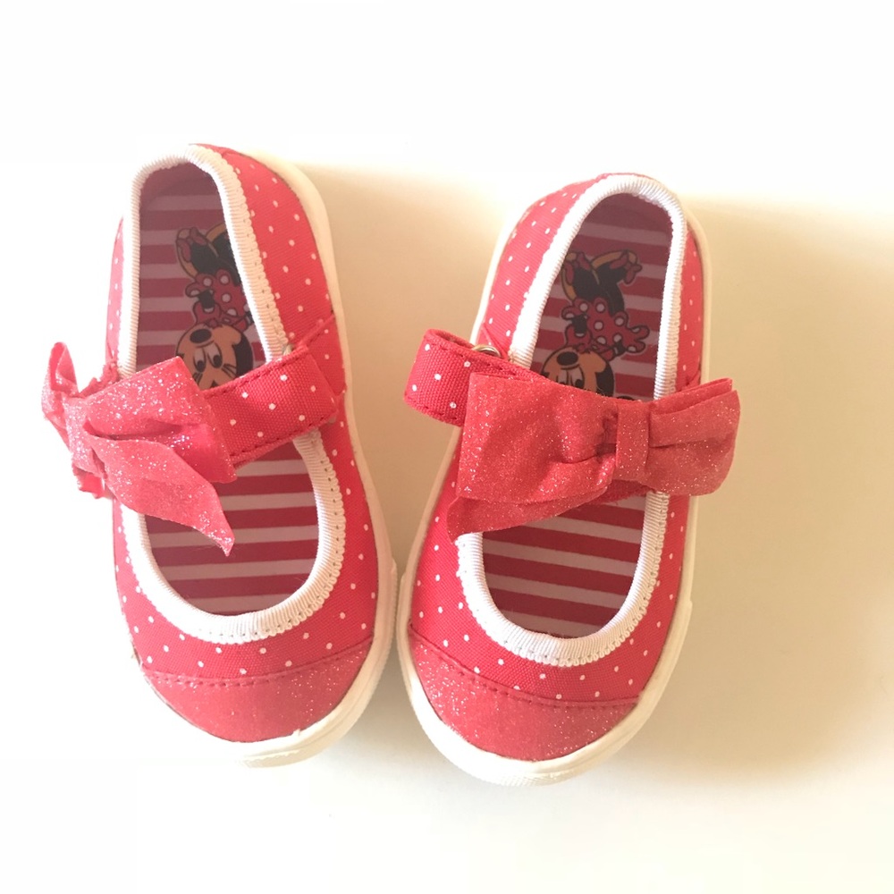 Disney brand red sneakers with bow. Never worn.